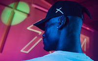 Streetwear drip from the back of the black Scum cap